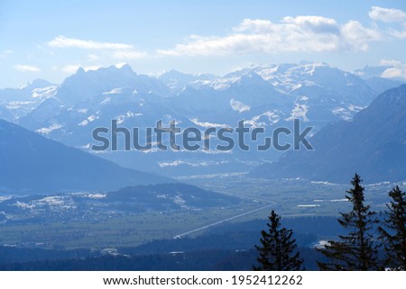 Panoramic landscape with snow capped Swiss alps in the background. Photo taken April 8th, 2021, Zurich, Switzerland.