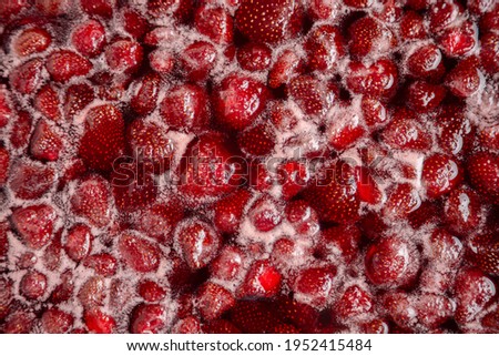 Strawberry jam is boiling, detailed shooting. Close-up of strawberry jelly boiling in a saucepan. Preparation of strawberry jelly, marmalade or strawberry sauce.