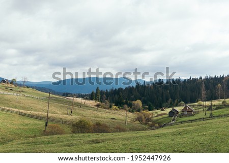 Countryside route from Carpathian Mountains. An image of a valley landscape with cloud weather and forest. 