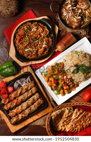 Pakistani Cuisine Barbecue, restaurant style food, spicy, juicy BBQ with Naan and juices Ramadan Special, Eid festivities, dinner menu Royalty-Free Stock Photo #1952504830