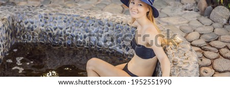 BANNER, LONG FORMAT Woman relaxing in round outdoor fragrant herbal bath, organic skin care, luxury spa hotel, lifestyle photo