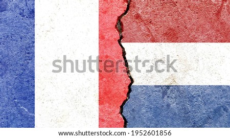 France VS Netherlands national flags on broken wall with cracks background, abstract France Netherlands politics economy relationship friendship divided conflict concept