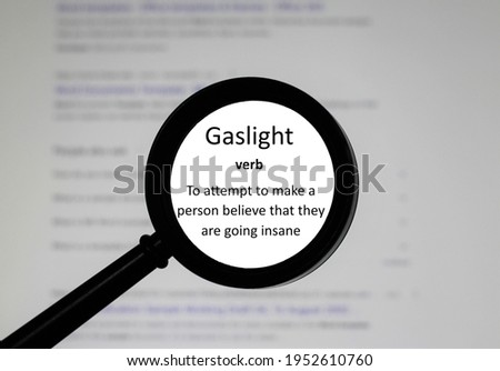 Gaslight, word in a dictionary. Close up of an English dictionary page with the word Gaslight Royalty-Free Stock Photo #1952610760