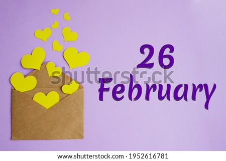 Brown envelope with yellow hearts on lilac background and inscription February 26, holiday concept.