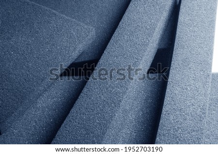 pile of lots of bluish-gray spongy foam material Royalty-Free Stock Photo #1952703190