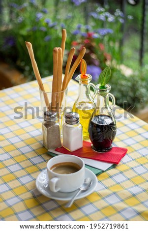 Italian serving. Table set of olive oil, bread sticks, salt, pepper