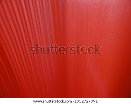 A close up shot of several red blurred moving lines. Camera Movement. Abstract shape.