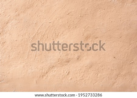 Blurred picture dry texture of mud background, wall of clay house structure. Soft picture