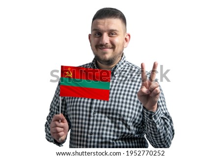 White guy holding a flag of Transnistria and shows two fingers isolated on a white background.