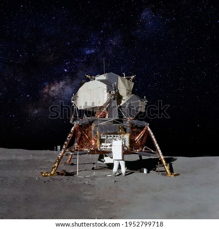 Astronaut on moon (lunar) landing mission with earth on the background. Elements of this image furnished by NASA. Royalty-Free Stock Photo #1952799718