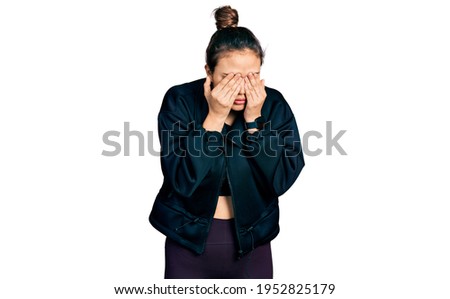 Young hispanic girl wearing sportswear rubbing eyes for fatigue and headache, sleepy and tired expression. vision problem 