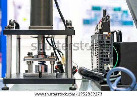 hydraulic press machine and plc computer or controller during metal spring test property durability endurance fatigue pressure force etc. Royalty-Free Stock Photo #1952839273