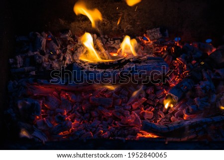Brazier with fire and coals for cooking on the fire. Background