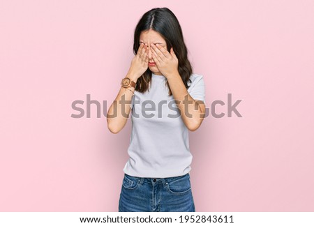 Young beautiful woman wearing casual white t shirt rubbing eyes for fatigue and headache, sleepy and tired expression. vision problem 
