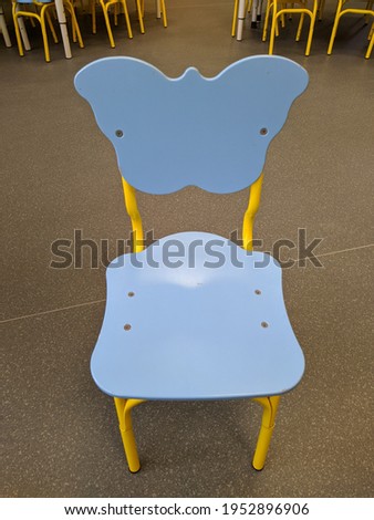 one small and children's wooden blue chair with a back