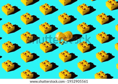 Yellow cubes with a sharp shadow on a blue background. Minimal summer concept.
