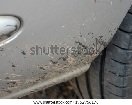 The asphalt is stuck on the car. Royalty-Free Stock Photo #1952966176
