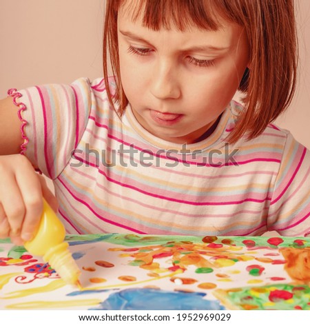 Art and fun leisure time concept. Beautiful child girl painting picture. Horizontal image. 