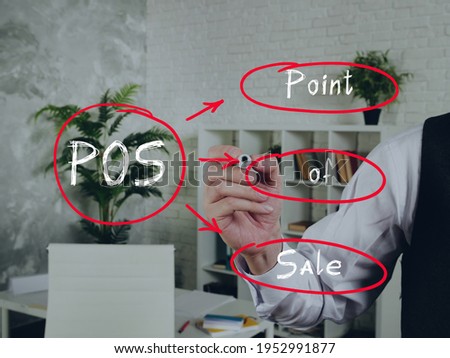 Written phrase POS Point of Sale . Fashion and modern office interiors on an background.
