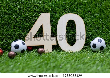 Soccer 40th Birthday with ball on green grass