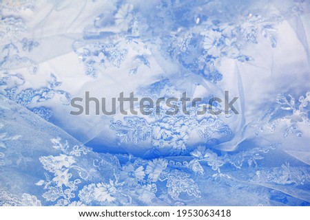 The lace is light blue. Texture. background. template. abstract background with pale blue rod, old lace and sapphire lines. can be used for postcard, poster, texture or wallpaper