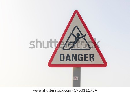 The sign means danger and you can't swim
