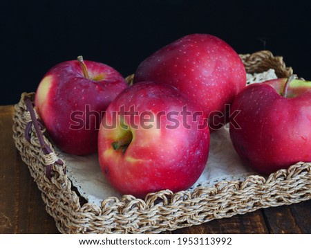 Bunch of big red apples, juicy, black background