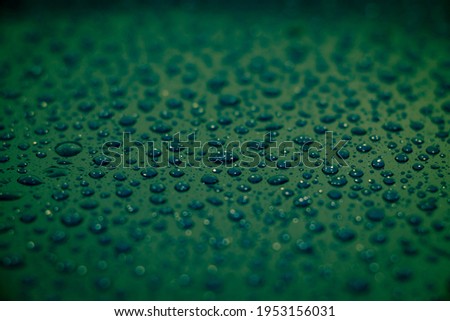 Rain drops on top of a plastic surface for beautiful wallpaper