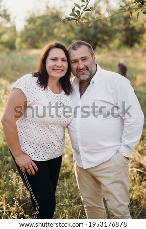 husband and wife in the summer in the park
