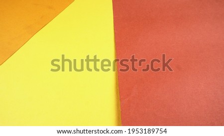 Yellow and Red paper background. Concept of primary colors. Angle and diagonal lines. Top view flat lay with copy space.