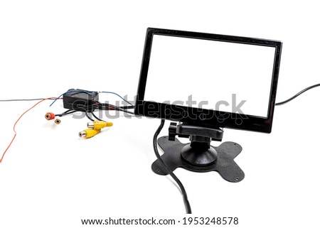 Touchscreen monitor for displaying navigation, rear view camera and car multimedia on a white isolated background. Audio and video electronics for transport