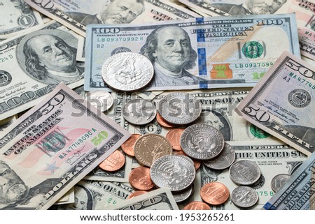 Half Dollar coin on Dollar Banknotes and differed USD coins. American Currency. Federal Reserve