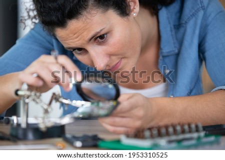 women technician fixing mobile phone repair and maintenance services