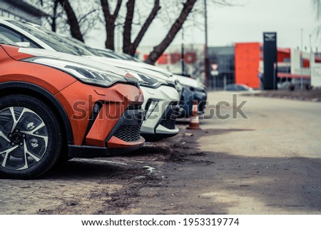 Many cars parked in a row Royalty-Free Stock Photo #1953319774