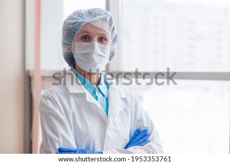 Empty space for text. Portrait of a female doctor in a hospital.