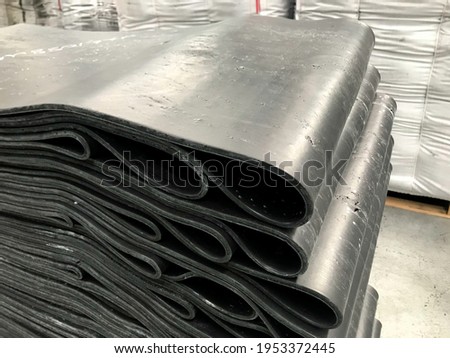 sliced rubber plates stacked on pallets Royalty-Free Stock Photo #1953372445