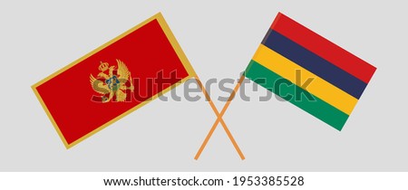 Crossed flags of Montenegro and Mauritius. Official colors. Correct proportion