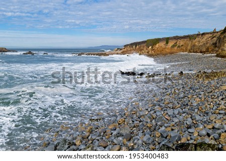 Waves crashing into a rocky beach 