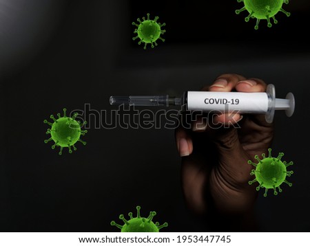 Concept fight against virus covid-19 corona virus, doctor or scientist in laboratory holding a syringe for children or older adults, Poor people have access to vaccine. Search engine about Covid-19.