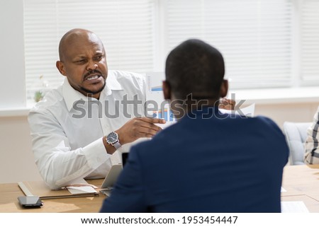 African Boss Shouting At Workplace. Conflict And Stress In Office Royalty-Free Stock Photo #1953454447