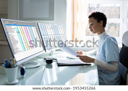 Medical Coding Bill And Billing Codes Spreadsheets Royalty-Free Stock Photo #1953455266