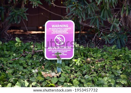 Warning reclaimed water purple sign