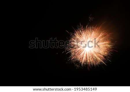 Beautiful bright firework lighting up night sky, space for text