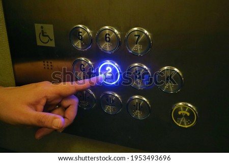 The disabled elevator button with braille code of the elevator. Universal design. Soft focus. Technology, sign and symbol concept.