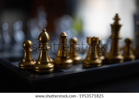 Chess. strategy ideas Planning and Decision concept business. gold queen chess surrounded by a number of fallen silver chess pieces , business strategy concept