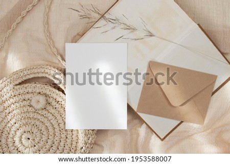 5x7 wedding card mockup with craft envelop and straw bag