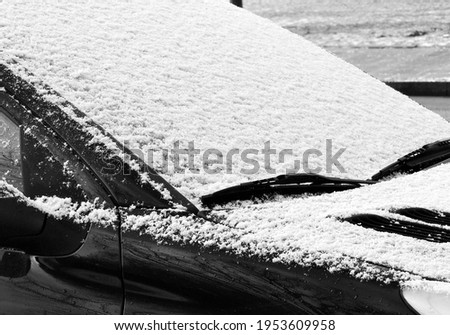 a snow covered car in winter