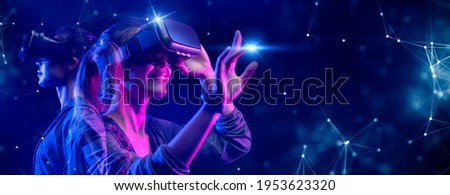 VR sport game virtual reality  recreation, teenager play virtual cyber space game, NFT game activity lifestyle of future    Royalty-Free Stock Photo #1953623320