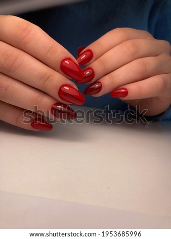 Stylish fashionable female manicure. Hands of a beautiful young woman and modern design.