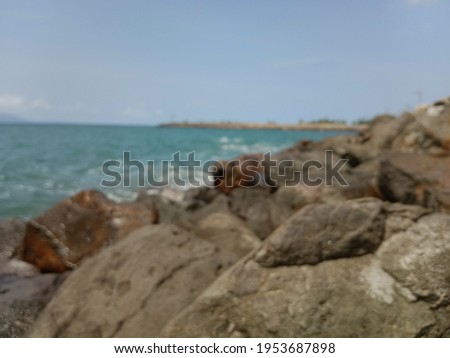 pictures of water and rocks on the beach during the day